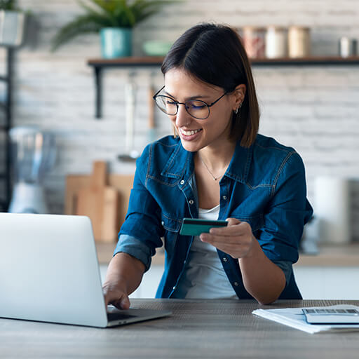 Happy woman with a Community First Credit Union debit card